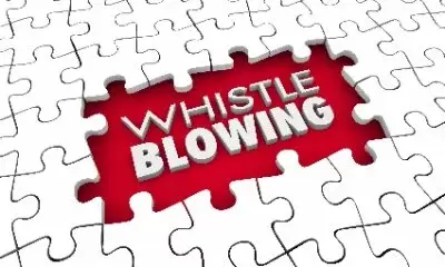 Whistle blowing in white on red background surrounded by jizsaw puzzle