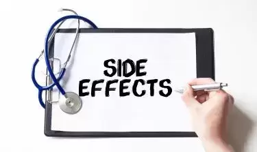mounjaro lawsuit: doctor writting side effects on white paper