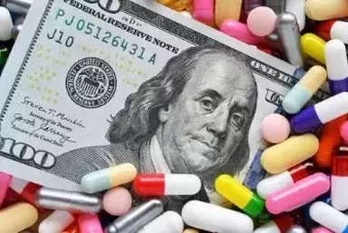 Trulicity lawsuit: hundred dollar bill on top of multi-colored capsules