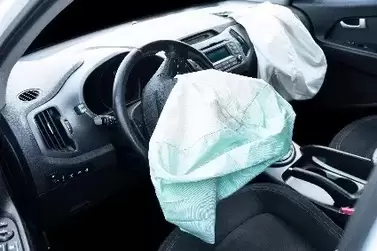 Inside of car after exploding ARC airbag explosed on driver's side.